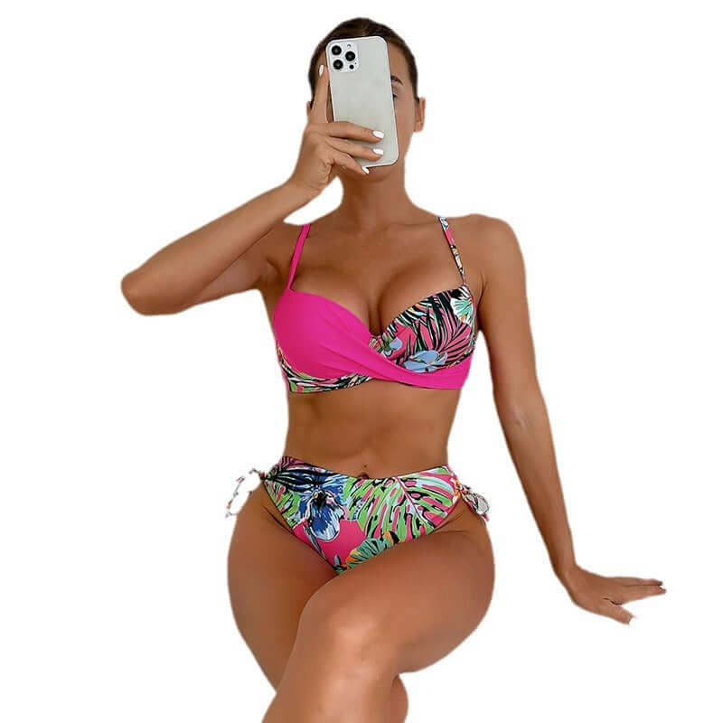 Model in a pink tropical print high waist cheeky bikini showcasing confidence in swimwear for all bodies.